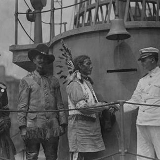 A War Bonneted Native American shakes hands with the Commander of the 'Recruit'