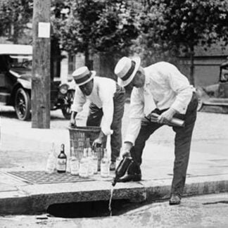 Agents Pouring liquor down a sewer on the Street
