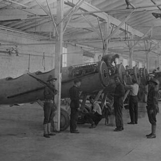 Airplanes Assembled Under the Watchful Eye of a Soldier at College Point