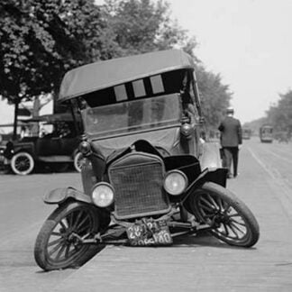 Automobile's Front axle breaks splaying tires outward causing vehicle to rest on its front bumper