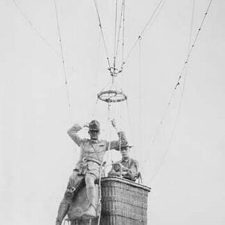 Balloon jump by a parachutist hanging from a basket suspended by it but out of the image