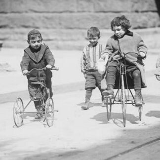 Children with Tricycles Playing in Manhattan Street