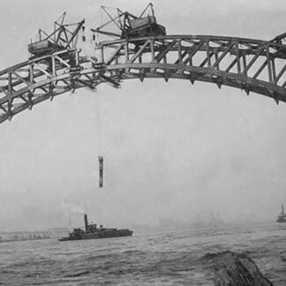 Completing the Hell Gate Railroad Bridge over the East River connecting Queens with Manhattan