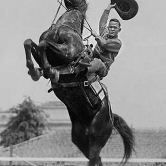 Cowboy Rides Rearing Horse & Waves his Hat