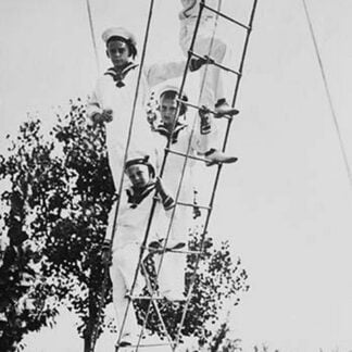 Crown Prince of Germany's Children frolic on what appears to be a ship's ratline or rope ladder