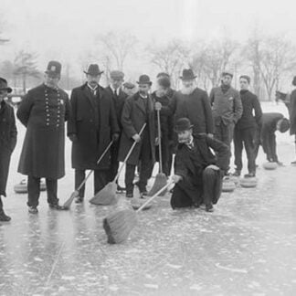 Curling in Central Park with Men having Brooms at the ready over the ice
