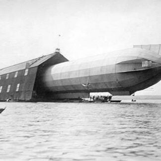 Dirigible in hanger over water