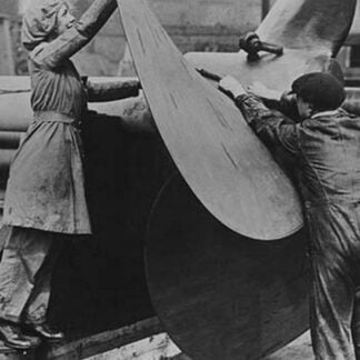 English Workers labor over a ship's Propeller at Shipyard
