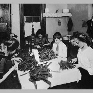 Family Sitting at Table Working with Garters