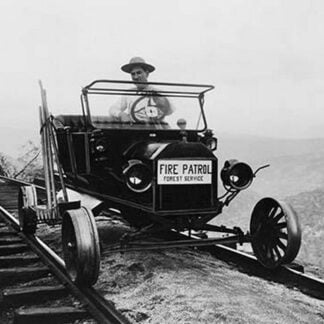 Fire Patrol Rides Steel wheeled car over Railroad Tracks