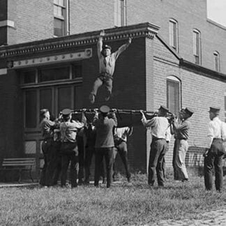 Firefighter Jumps into Net Held by Fellow Firemen