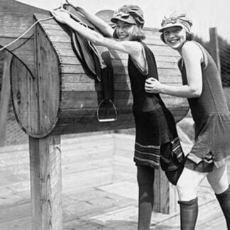 Girl is Helped by Friend to Mount a wooden Polo Dummy Horse