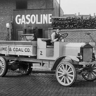 Grove Lime & Coal Company in front of a building sign that reads Gasoline