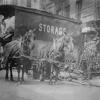 Horse Drawn Wagon with sign saying STORAGE unload the home content of a family being evicted