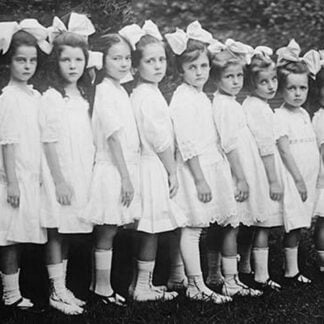 Line up of Beautiful Kindergartners in a row wearing white dresses