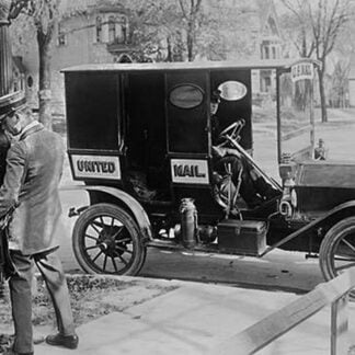 Mailman at Post Box with his truck parked at the curb