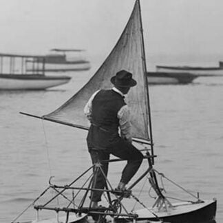 Man stands on Sail Driven water Tricycle