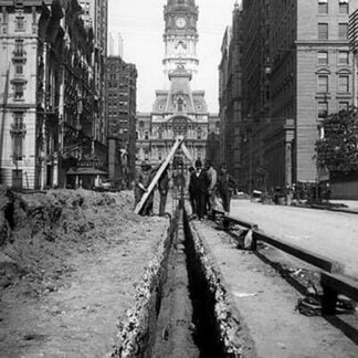 Men Posing While Laying Pipe