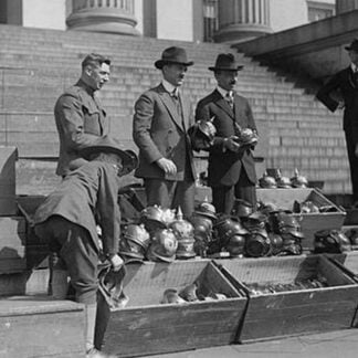 Men unload Prussian Helmets