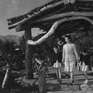 Mrs. Nakamura and family in park by Ansel Adams