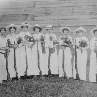 Nemours Women's Trap shooting Club in elegant dress hold both nosegays and rifles