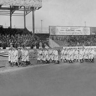 New York Yankees show support for the Troops in World War I by marching around the stadium on baseball uniforms and carrying rifles over their shoulders