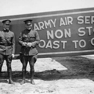 Pilots pose in front of a Plane that they fly coast to coast