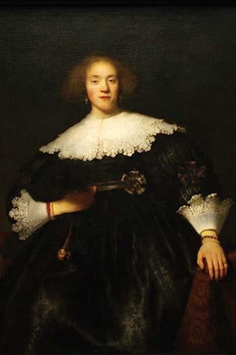 Portrait of a Seated Woman with Pendant by Rembrandt Van Rijn