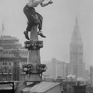 Reynolds Juggles balls on the Pinnacle of a roof high above New York City