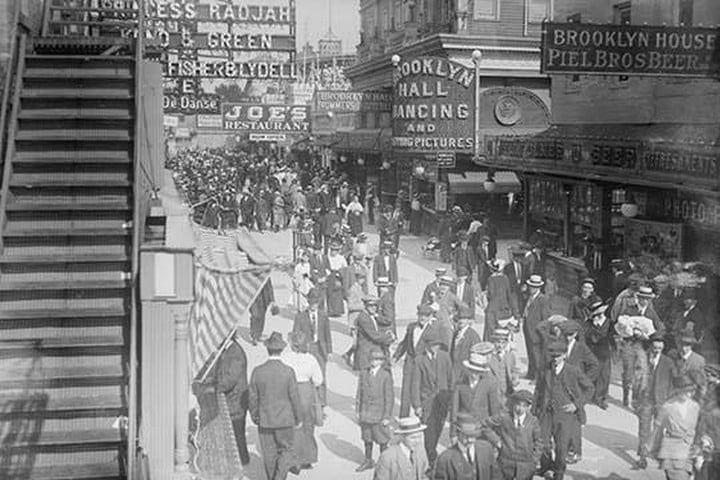 Surf Avenue in Coney Island Abustle with throngs of revelers