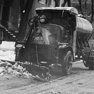 Tank Truck with Snow Plow Cleans the Streets