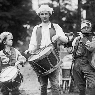 Three Boys March with Instruments on the 4th of July Celebration