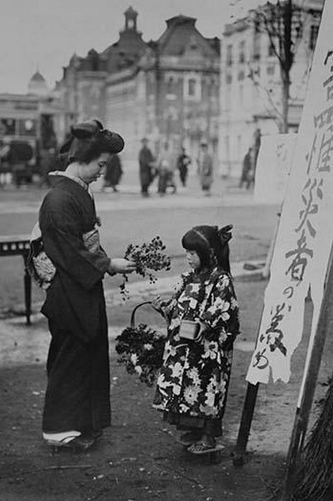 Toddler in front of Shop sign sells flowers to a kimono wearing young lady #2