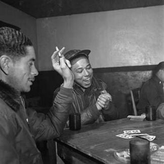 Tuskegee airmen playing cards in the officers' club in the evening