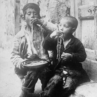 Two Neapolitan Children slurp down Spaghetti