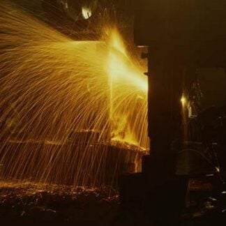 Welder's Torch Has Sparks Fly on Locomotive factory Floor