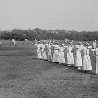 Woman's Archery Team Fires Arrows at a line of targets
