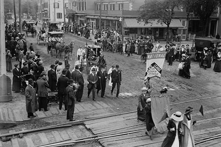 Women and Men march down Long Island Street to gain the Vote