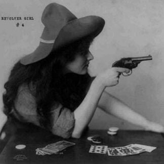 Young Cowgirl Hold Pistol Over a Table of Playing Cards